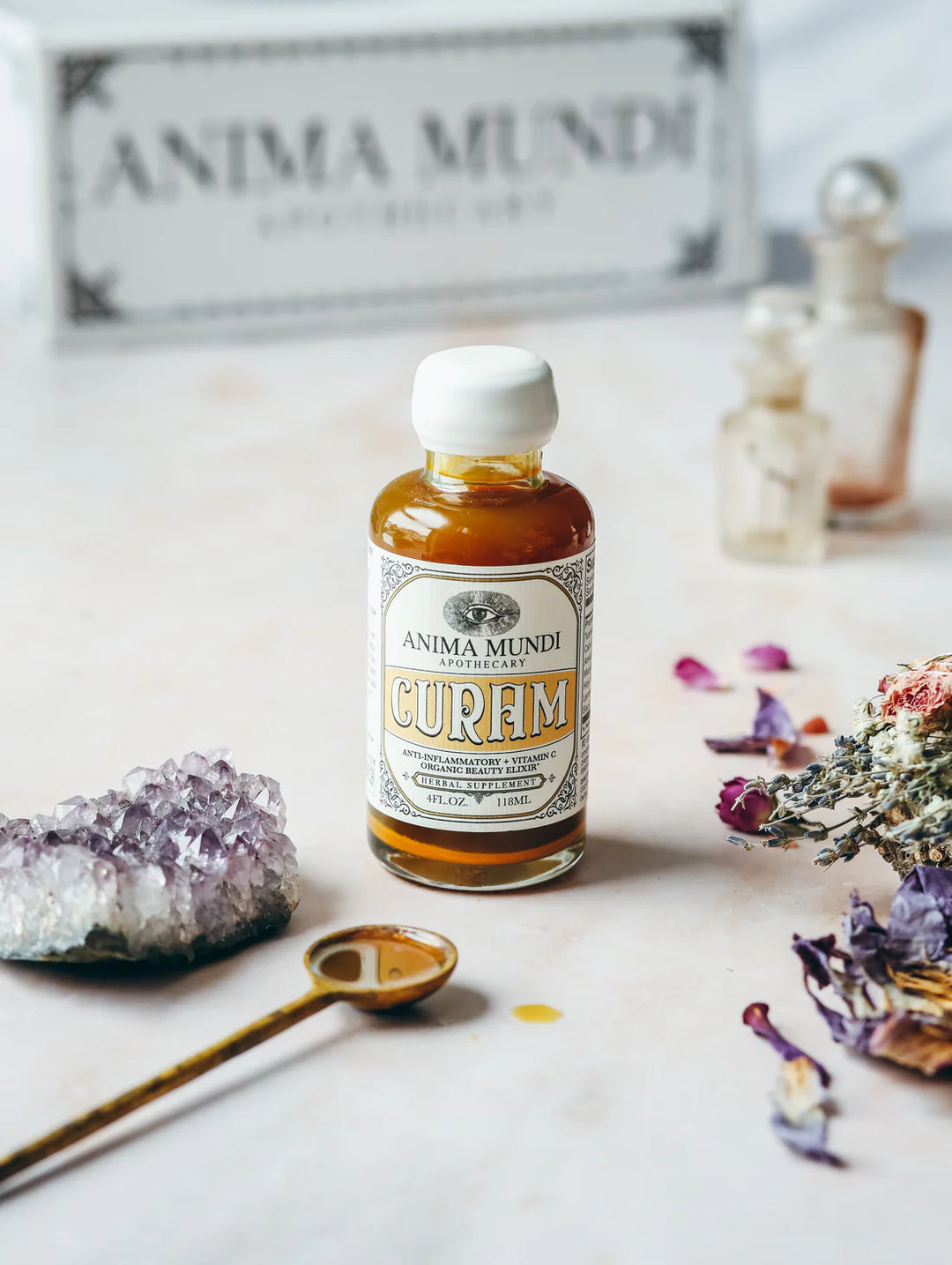 Curam Elixir von Anima Mundi - mit Inhaltsstoffen und Flüssigkeit in Dossierlöffel