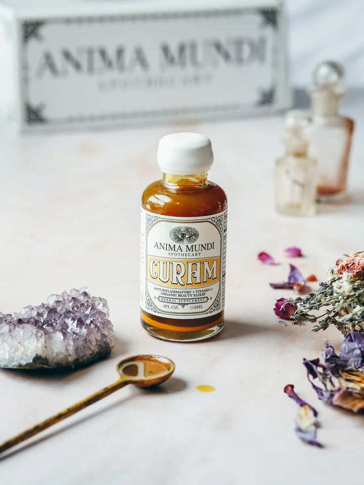 Curam Elixir von Anima Mundi - mit Inhaltsstoffen und Flüssigkeit in Dossierlöffel