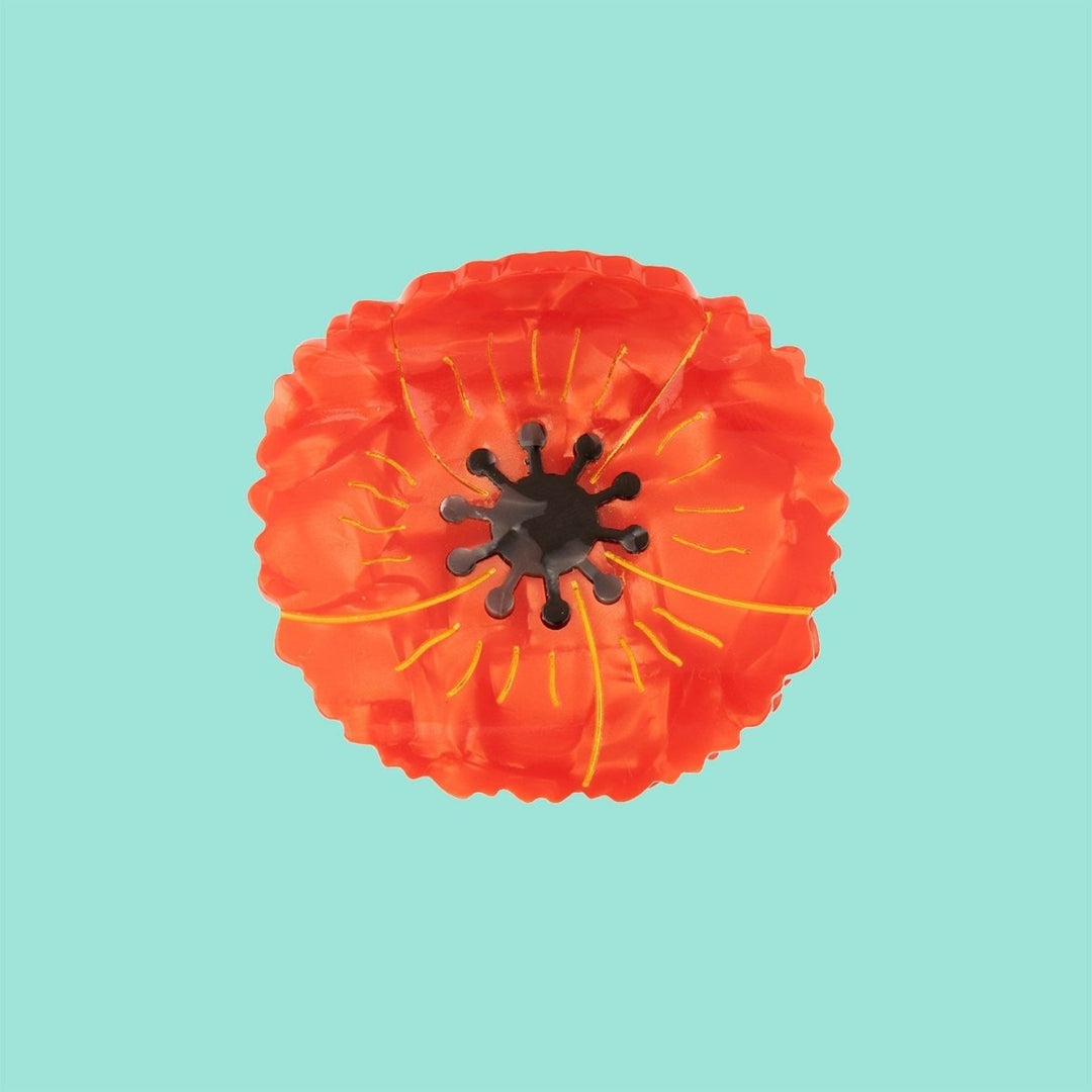 Coucou Suzette Poppy Hair Claw - Produktbild mit türkisem Hintergrund