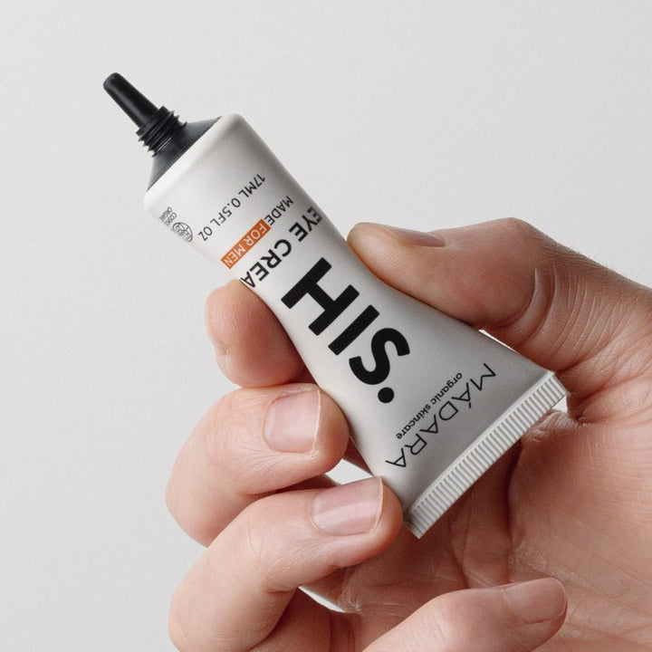 Mádara HIS Eye Cream - Tube mit Handmodel